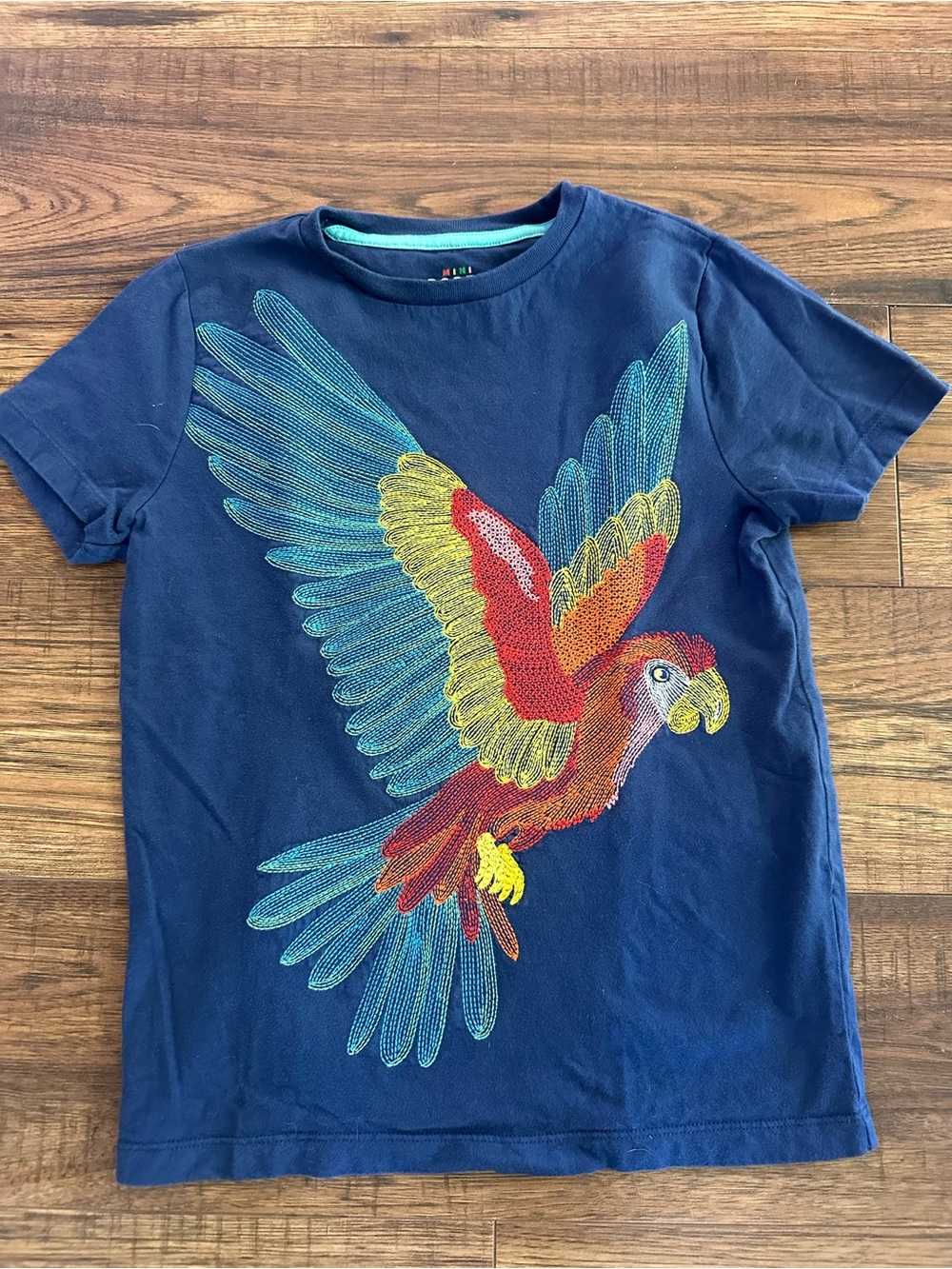 Mini Boden Navy Tee with Vibrant Parrot Graphic